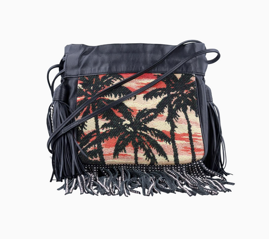 Handbag with palm tree design and fringes on a white background